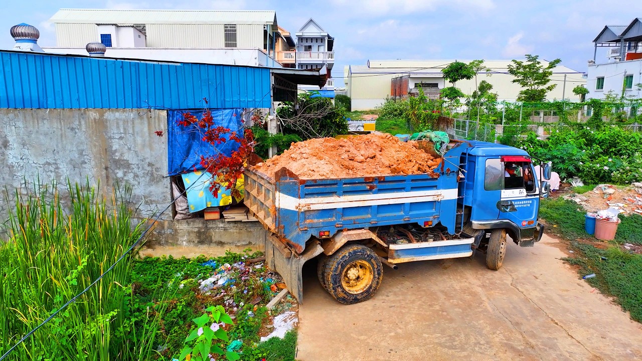 wonderful best landfill build school , truck unload soil , bulldozer old push soil to water