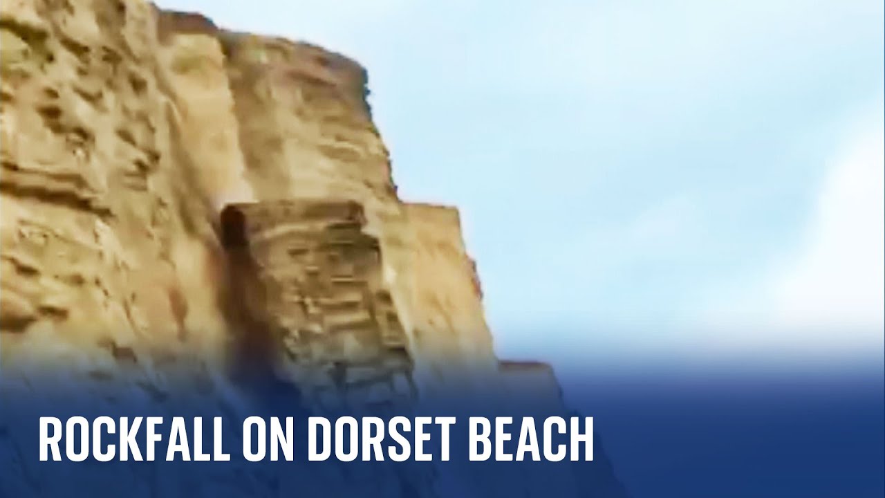 Dorset: Rockfall on a beach narrowly misses people walking below