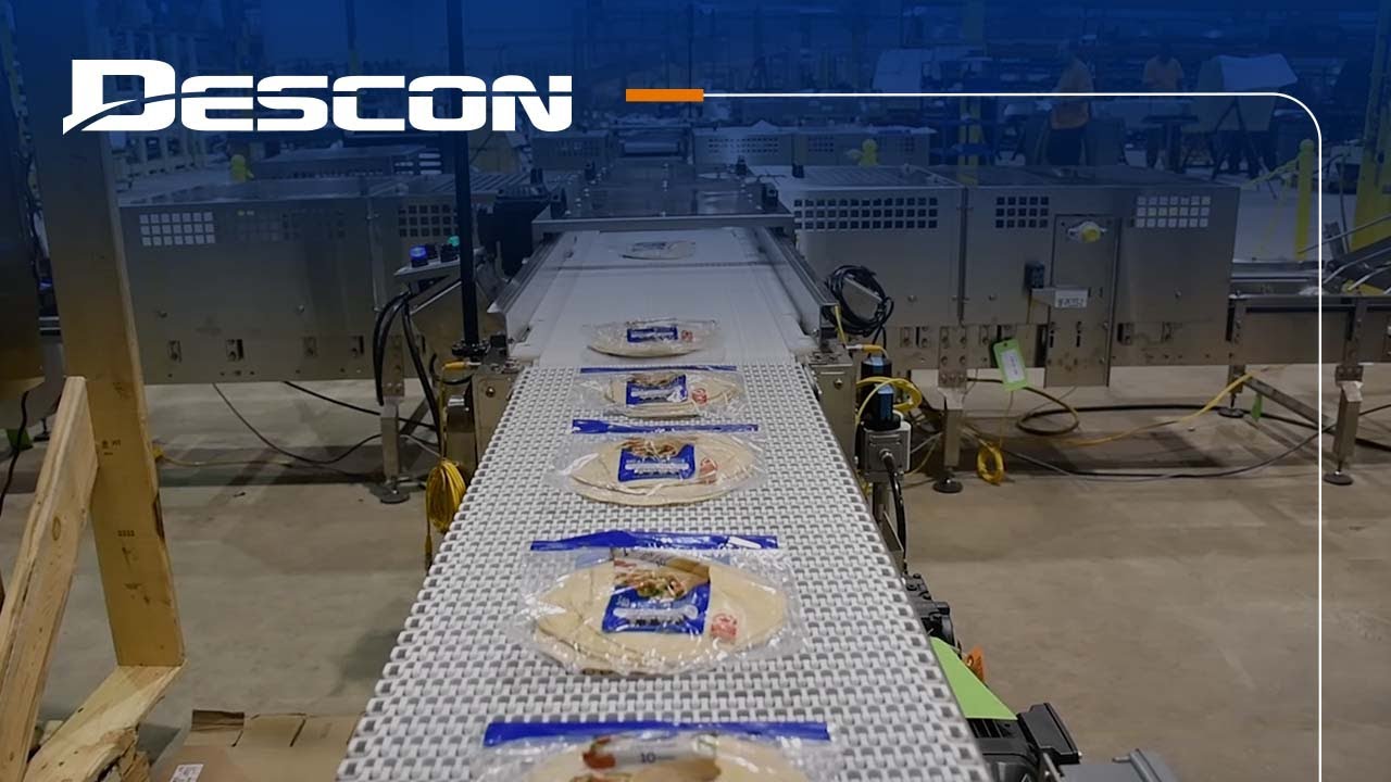 Descon Conveyor - New Reciprocating Tray Loader and Stacker for Packaged Goods