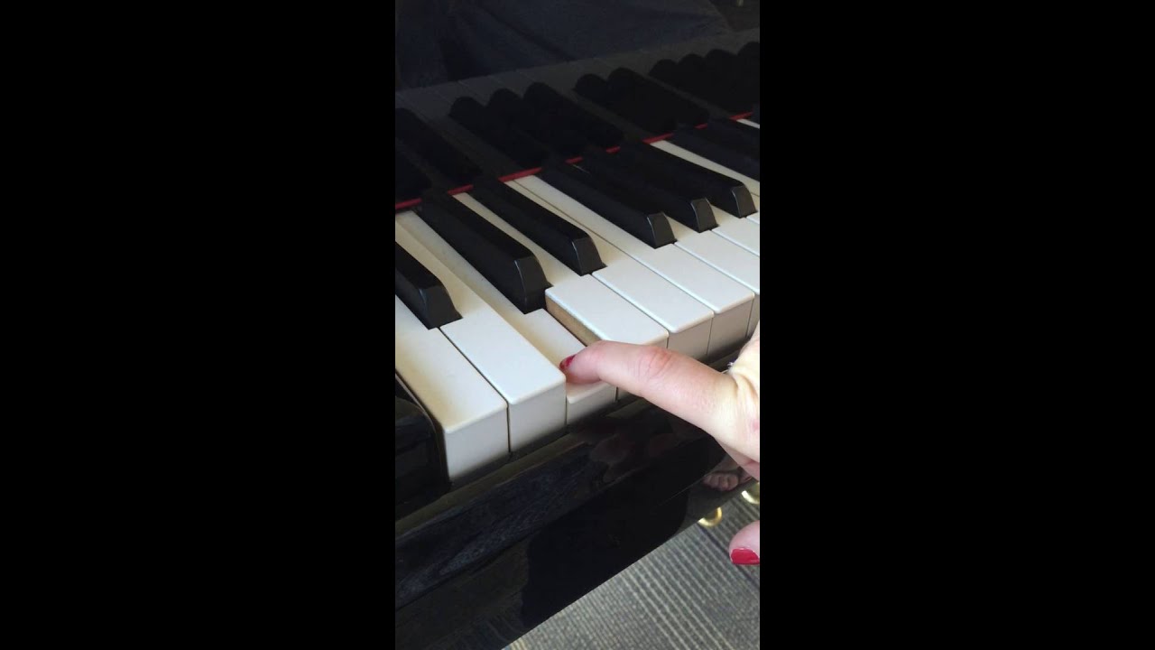Playing A Low Note on a Piano
