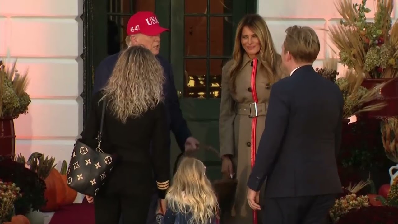 Melania and Donald Trump give candy bars to White House staffers children at Halloween event