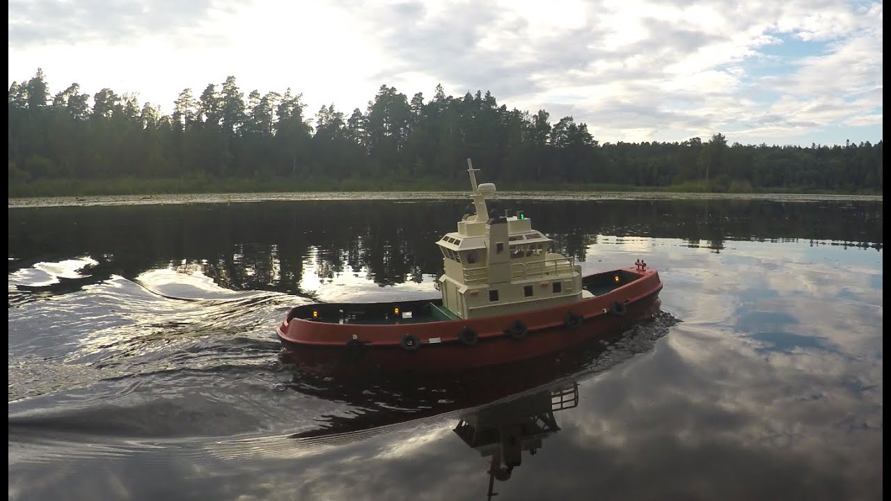 Henglong tugboat on a mirror reflective lake