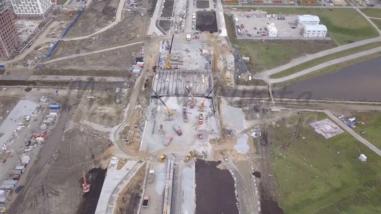 D-Log. Ekaterinburg, Russia. The construction of a bridge over the river. New Construction Area - Ak