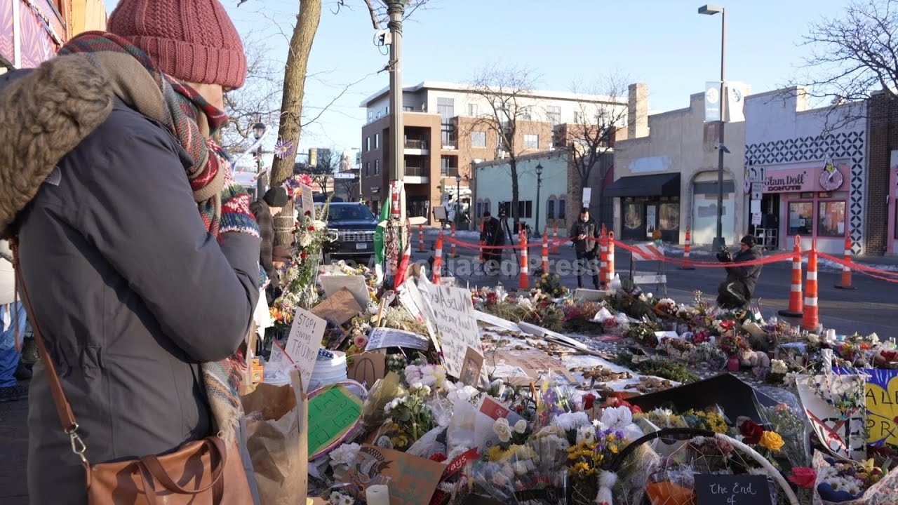 Minneapolis community and visitors react to immigration enforcement at Alex Pretti memorial