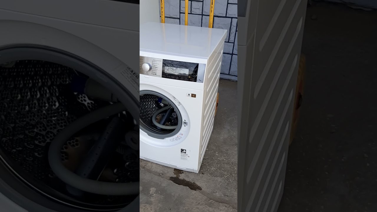 Стирально-сушильная машина AEG L99695HWD 9/6 кг с тепловым насосом