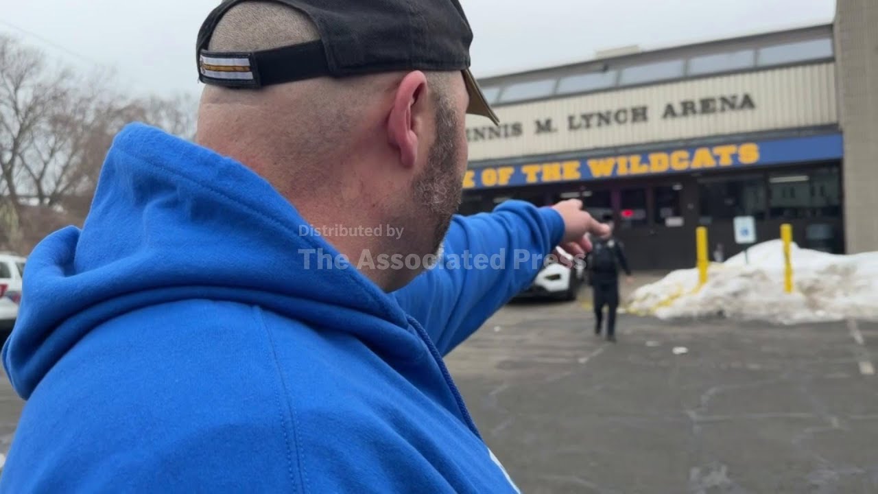 Rhode Island man and his son lay hockey sticks and flowers at the site of a deadly shooting