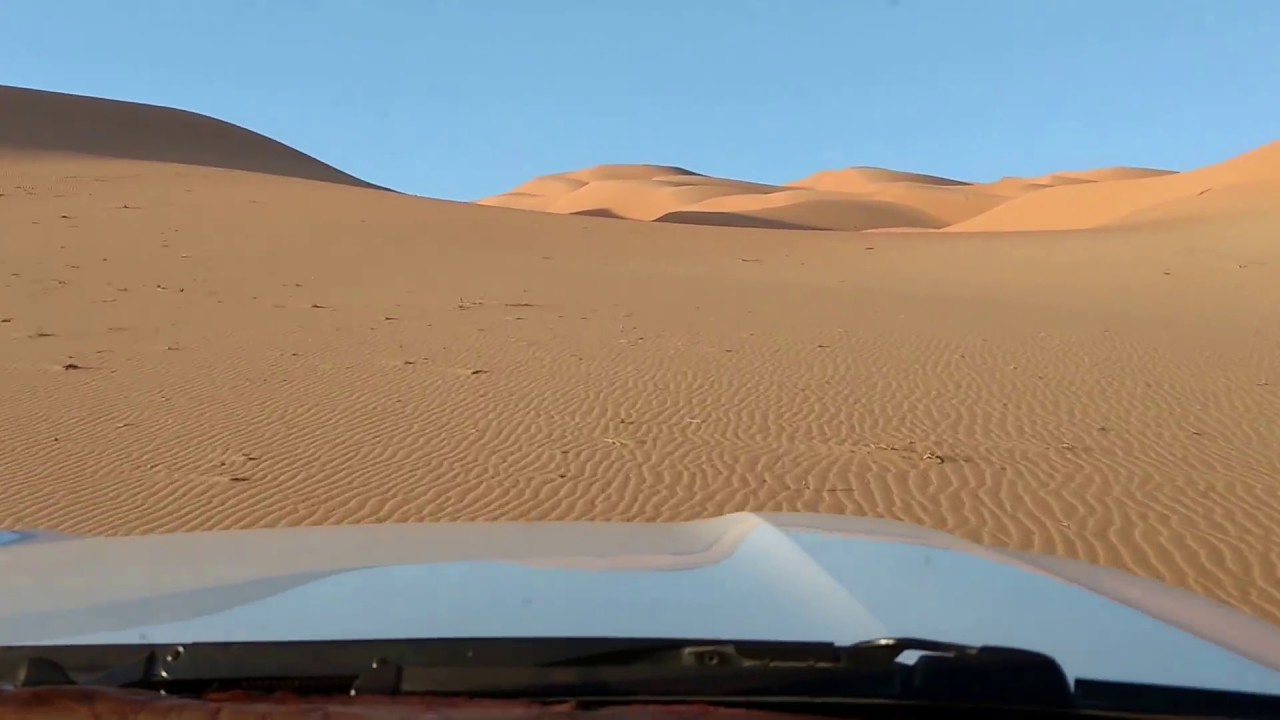 Riding up a sand-dune in the Empty Quarter Desert of Oman.