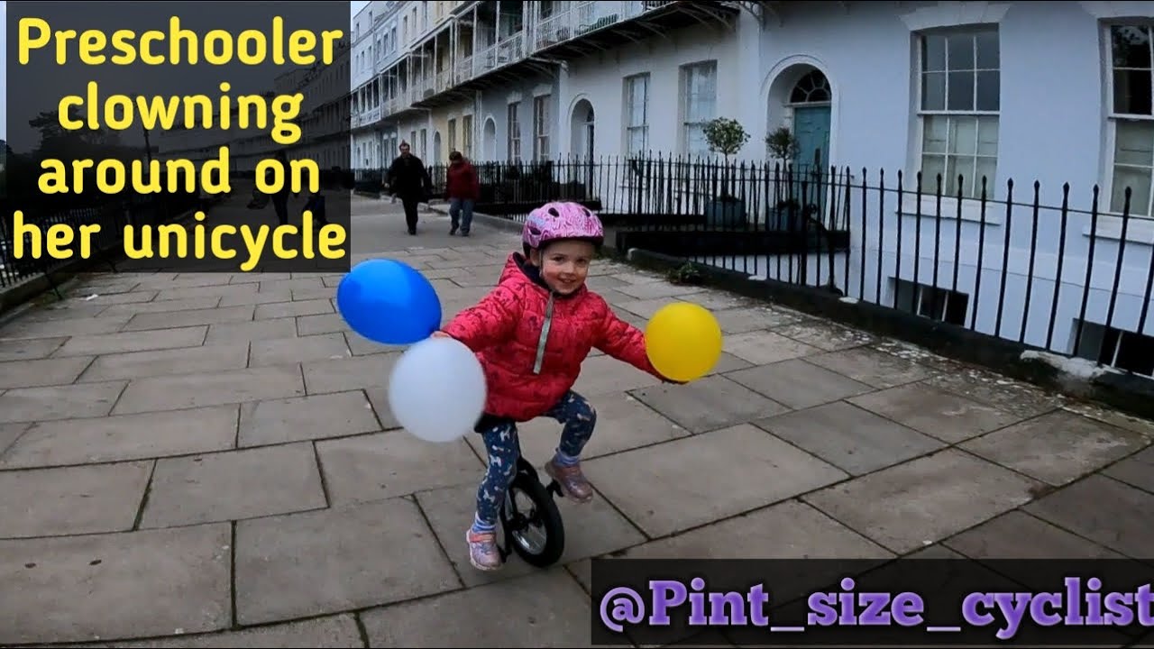 4 year old clowning around on her unicycle
