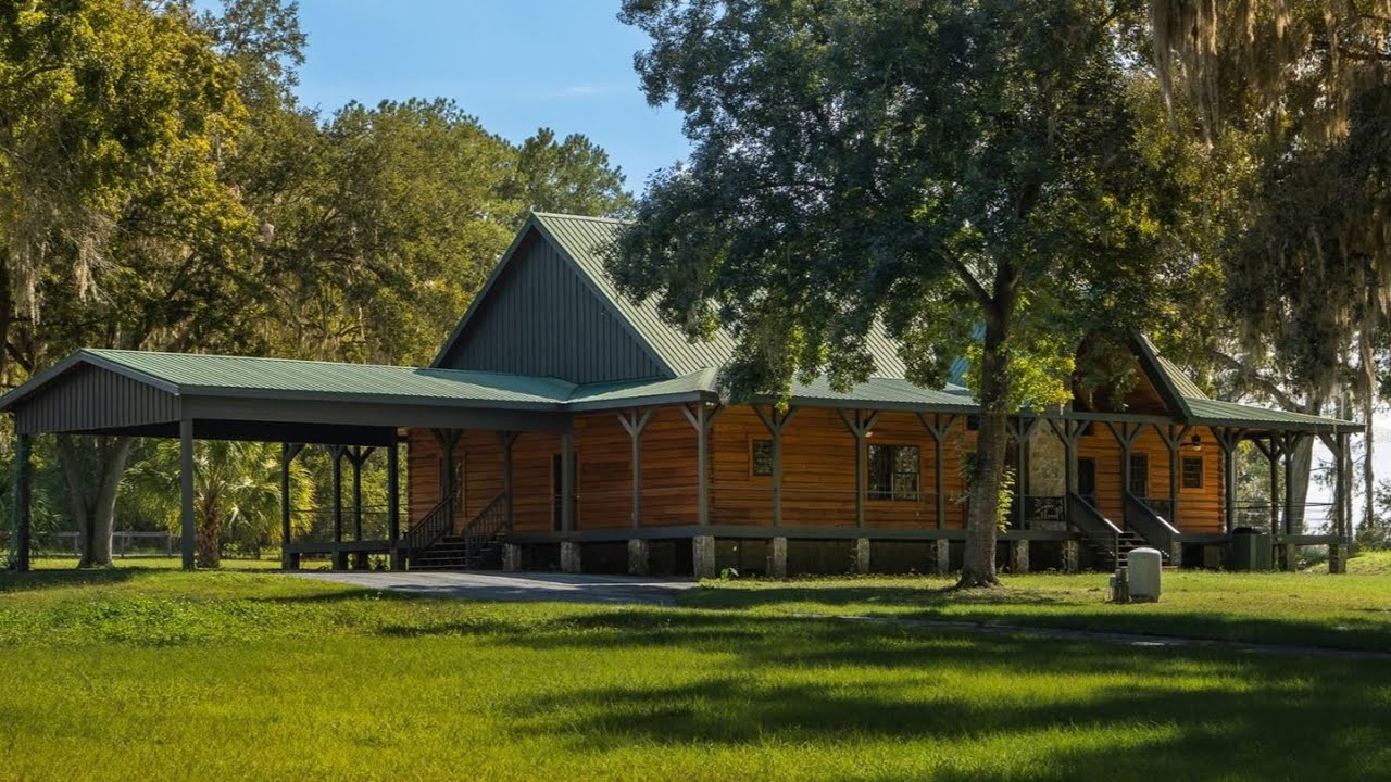 LOG CABIN EQUESTRIAN RETREAT! | 20-Acre Farm w/ 25 Stalls, Arena & Guest Apt (Near WEC)