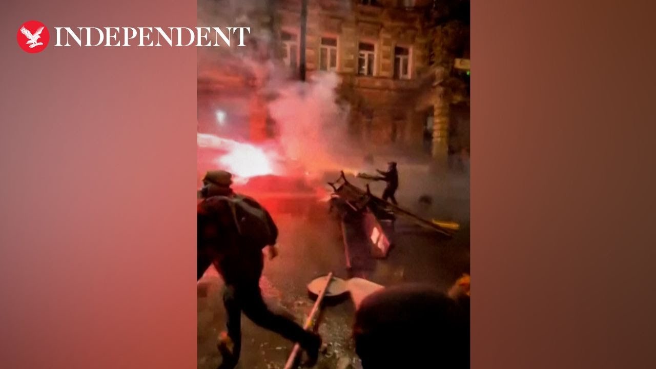 Protester shoots fireworks at police during pro EU protests in Georgia
