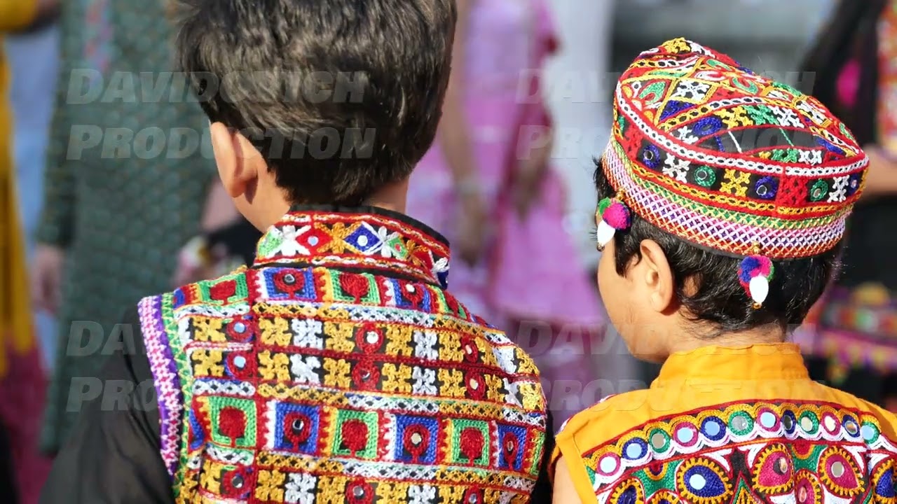 Indian festival celebration showing children wearing vibrant traditional embroidered clothing