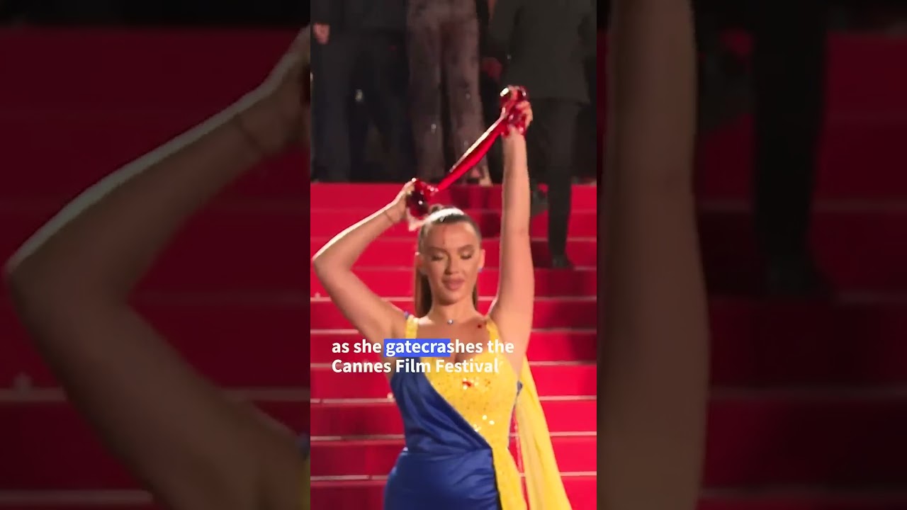 Protester pours fake blood on herself at Cannes Film Festival   AFP #shorts #ukraine #ukrainetoday