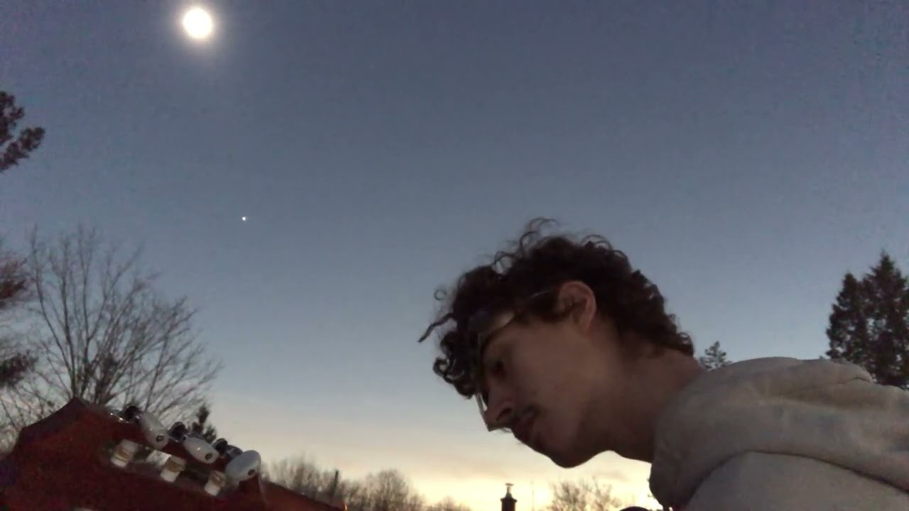 Playing the most beautiful classical guitar piece while the Sun and the Moon are doing funny things