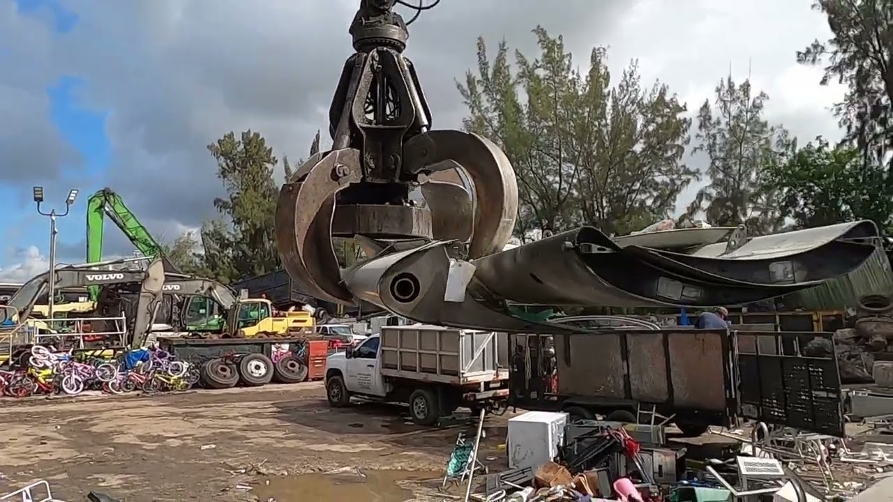sweeping,baling and loading a scrap truck