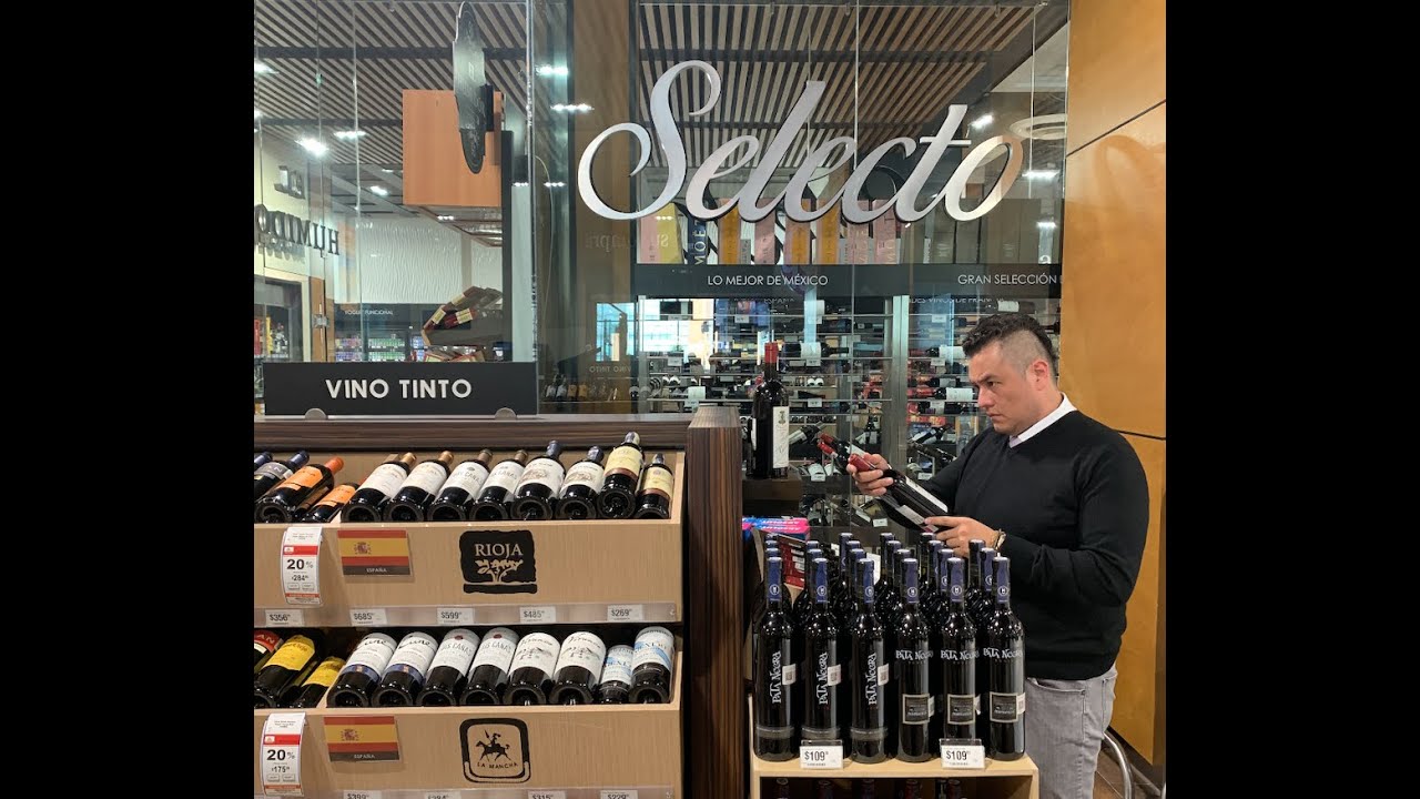 Recorrido por tienda gourmet, vinos por copeo, carnes premium y quesos muchos quesos