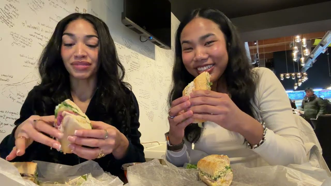 Eating a sandwich with my friend