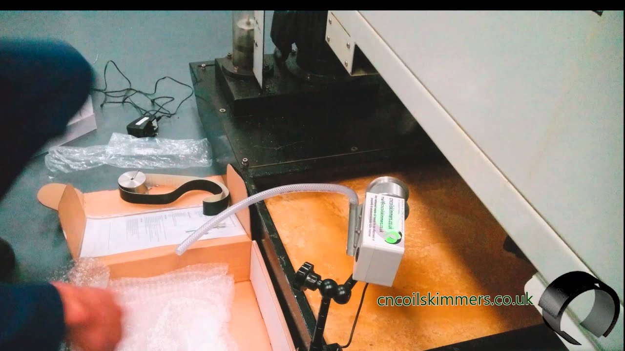 Oil skimmer installation on CNC machine.