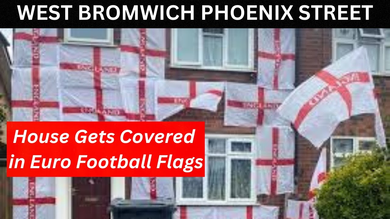 WEST BROMWICH PHOENIX STREET, The Euros FOOTBALL FLAGS cover the front of a house
