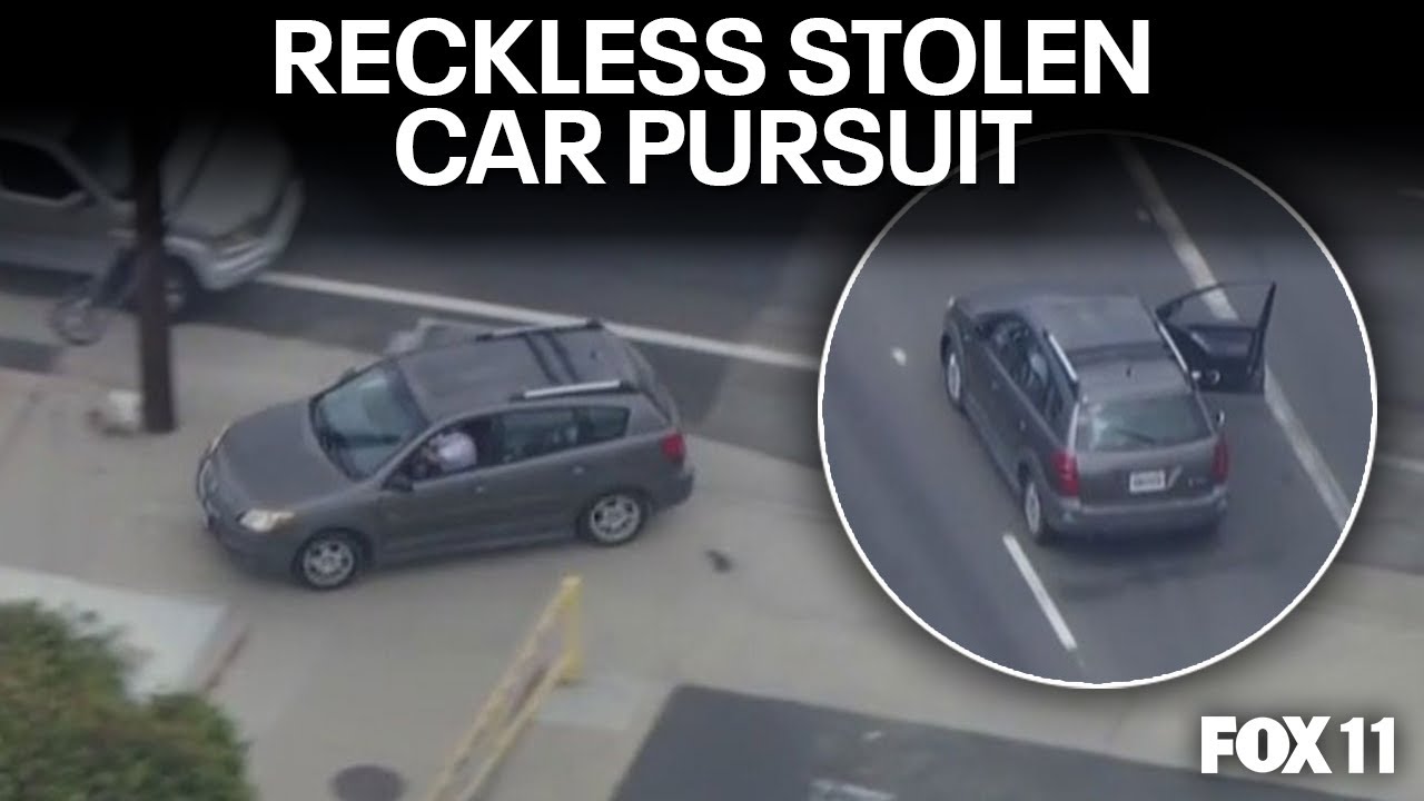 Wild police chase: Driver speeds with door open, drives on sidewalks