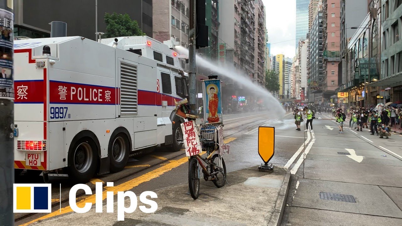 Police water cannon charge in Hong Kong
