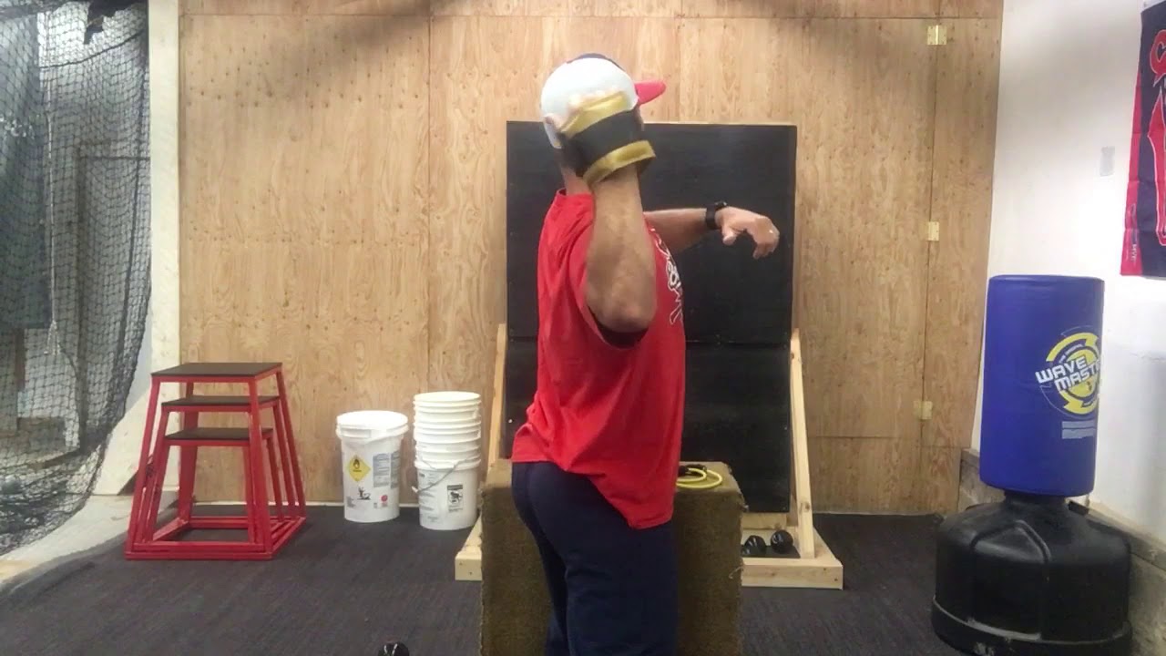 Fixing throwing arm path with wrist weights.