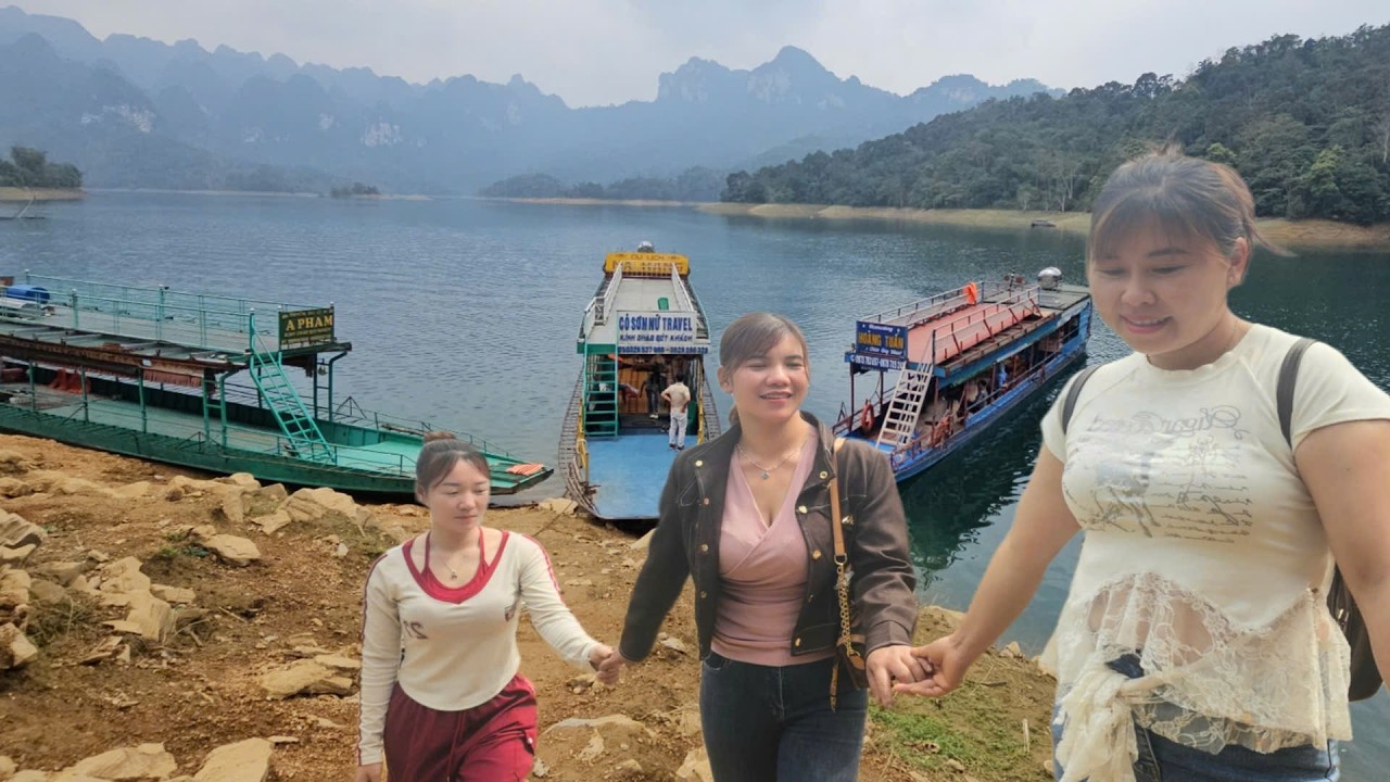 The girl and her siblings are enjoying nature on the lake.