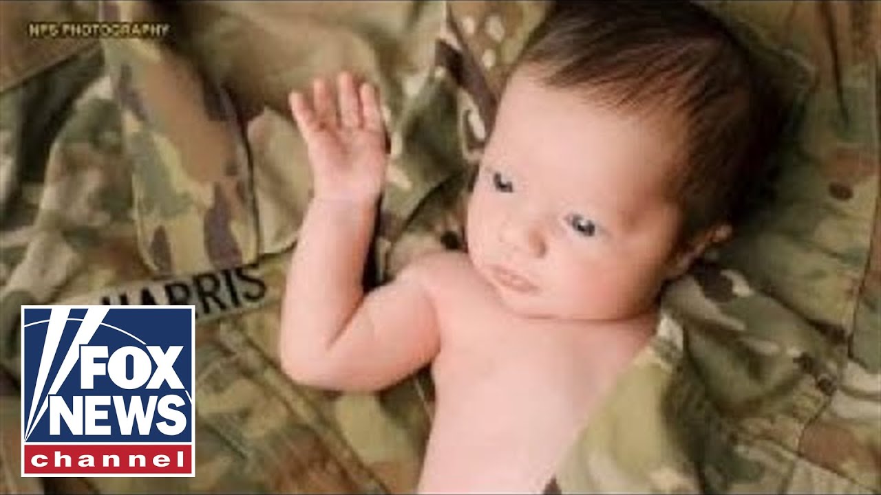 Baby poses in her late father's military uniform