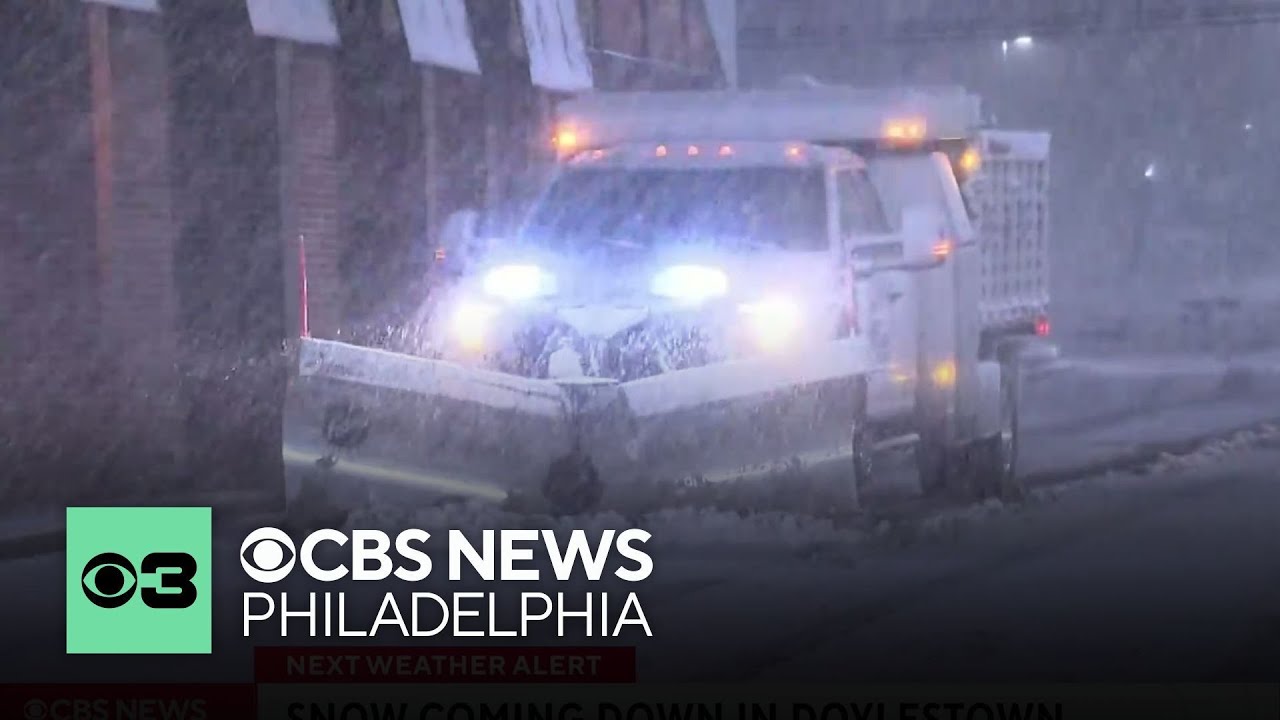 Crews head out to clear the roads in Doylestown, Pennsylvania, as snow starts to stick