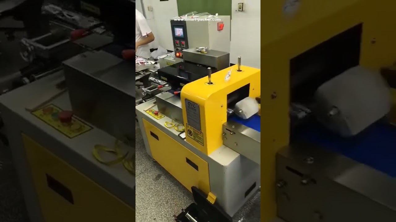 Hotel toothbrush pillow type automatic film wrapping sealing packing machine
