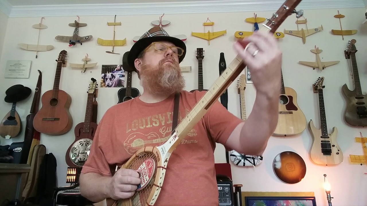 Denton Music - Low Rider on a 3 string tennis racket guitar!