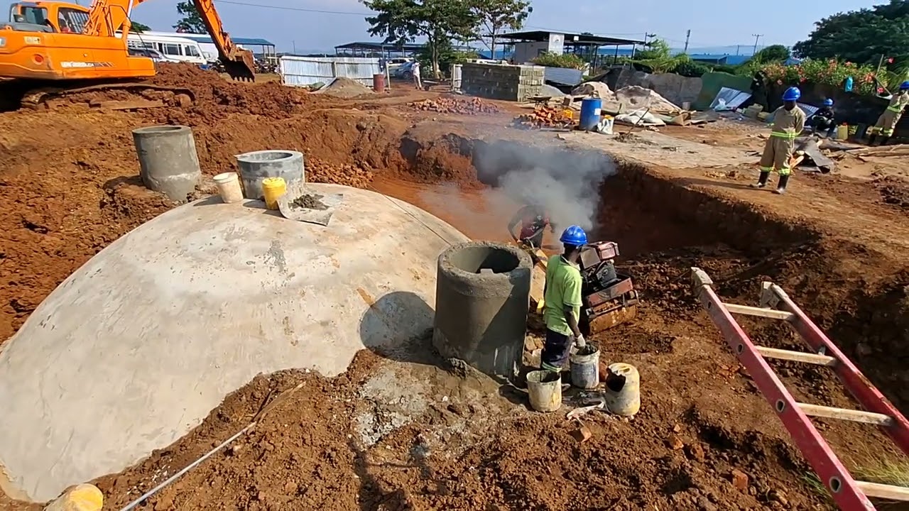 A pedestrian roller is being used to compact soil to prevent structural failures.