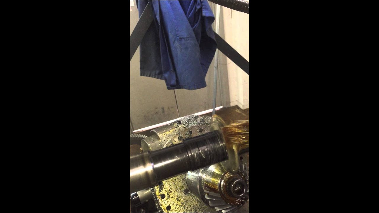 Spiral bevel gear cutting with a dividing head