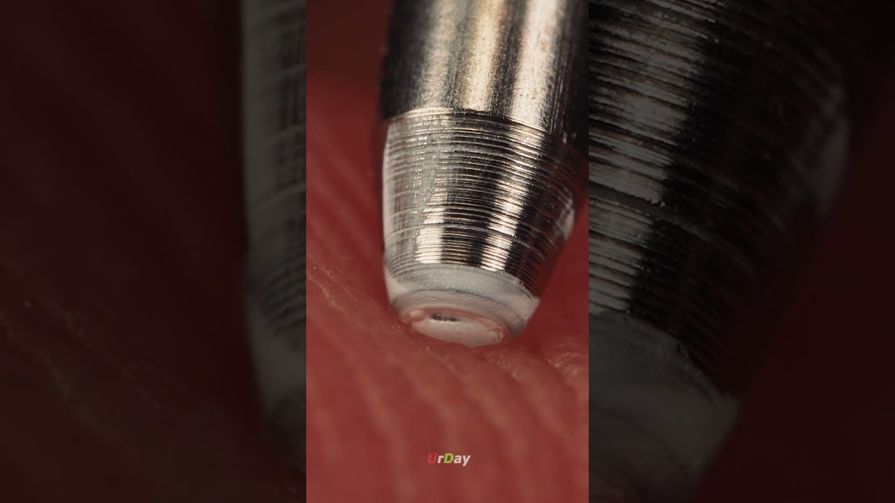 Extreme close up of a gel pen on finger 