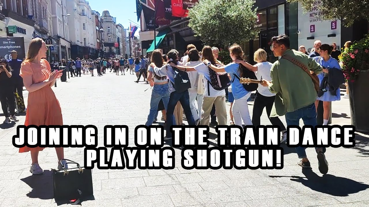 JOINING IN with the CROWD PLAYING SHOTGUN