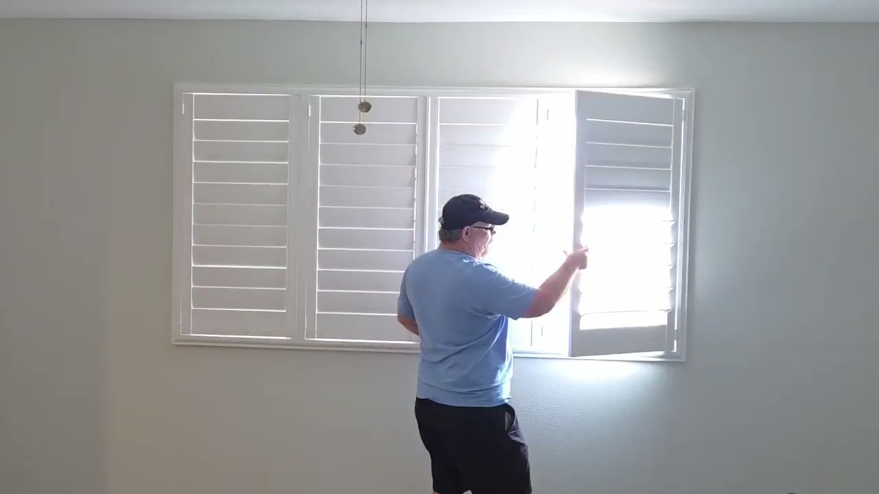 How do you open a custom plantation shutter panel?