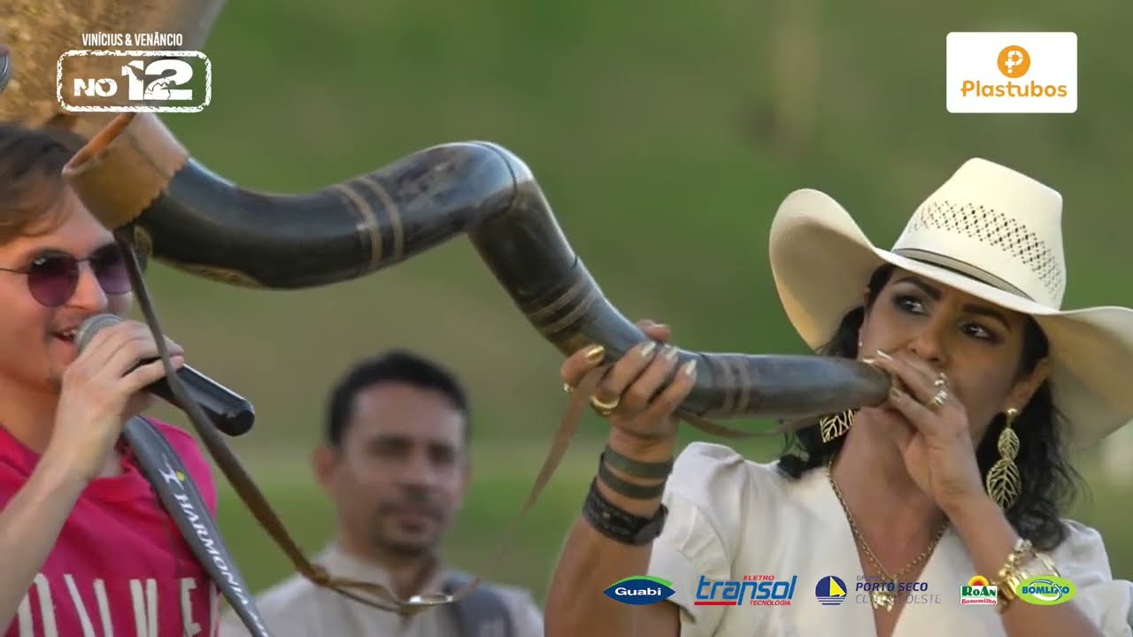 TBT Ana Carla Jacob tocando o berrante na Live no 12 dos goianos Vinícius e Venâncio