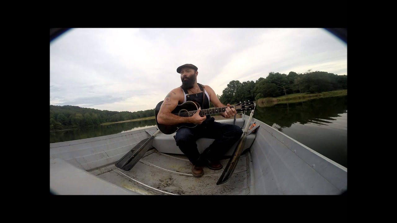 Front Porch Sessions: Rev. Peyton performs amazing finger style guitar tricks on a boat.