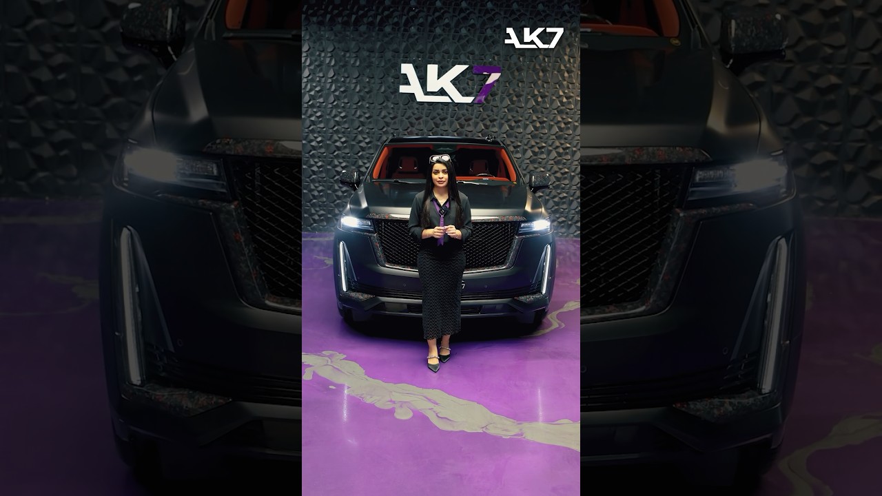 Enhancing the 2024 Cadillac with a striking fusion of forged carbon fiber and red accents. 