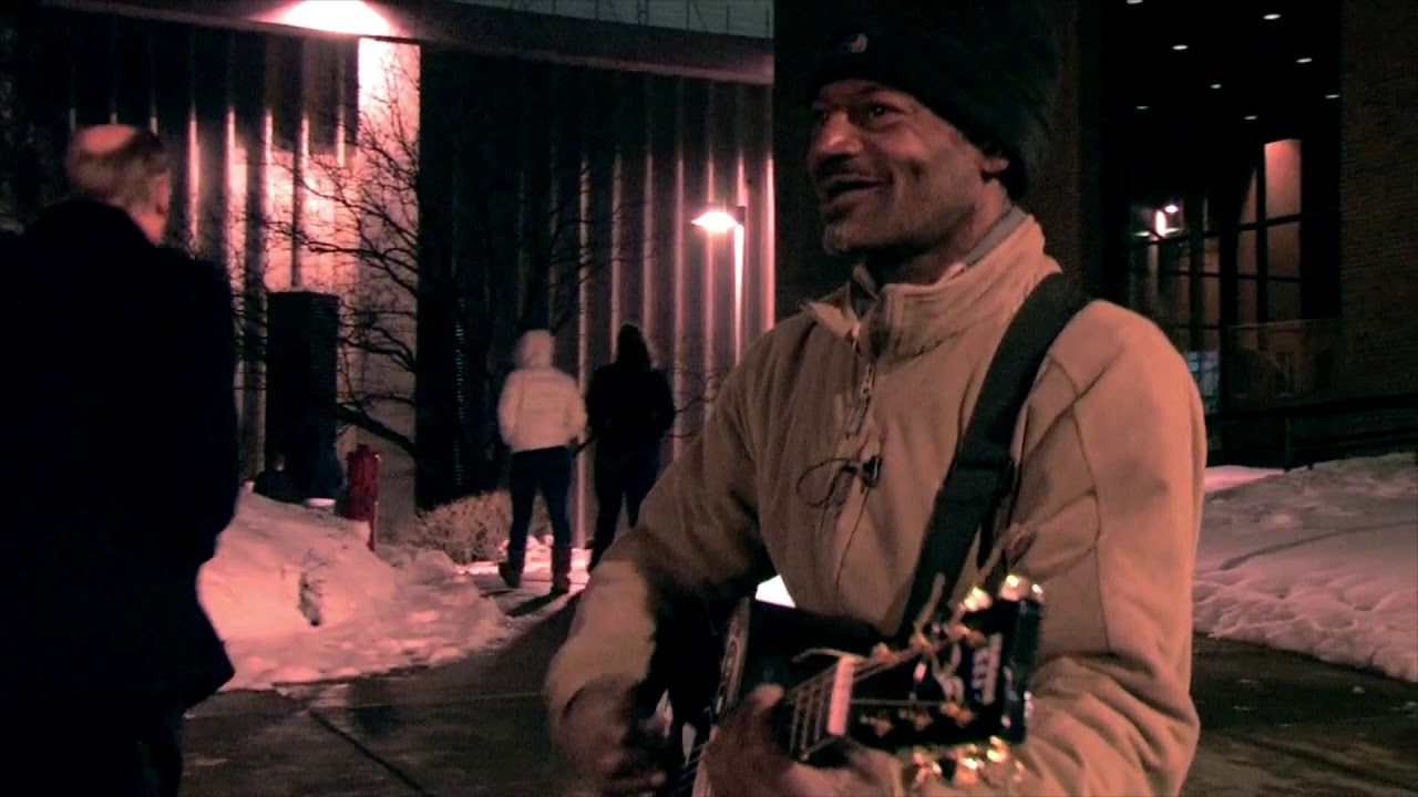Syracuse street musician Eli Harris performs outside Carrier Dome (2010)
