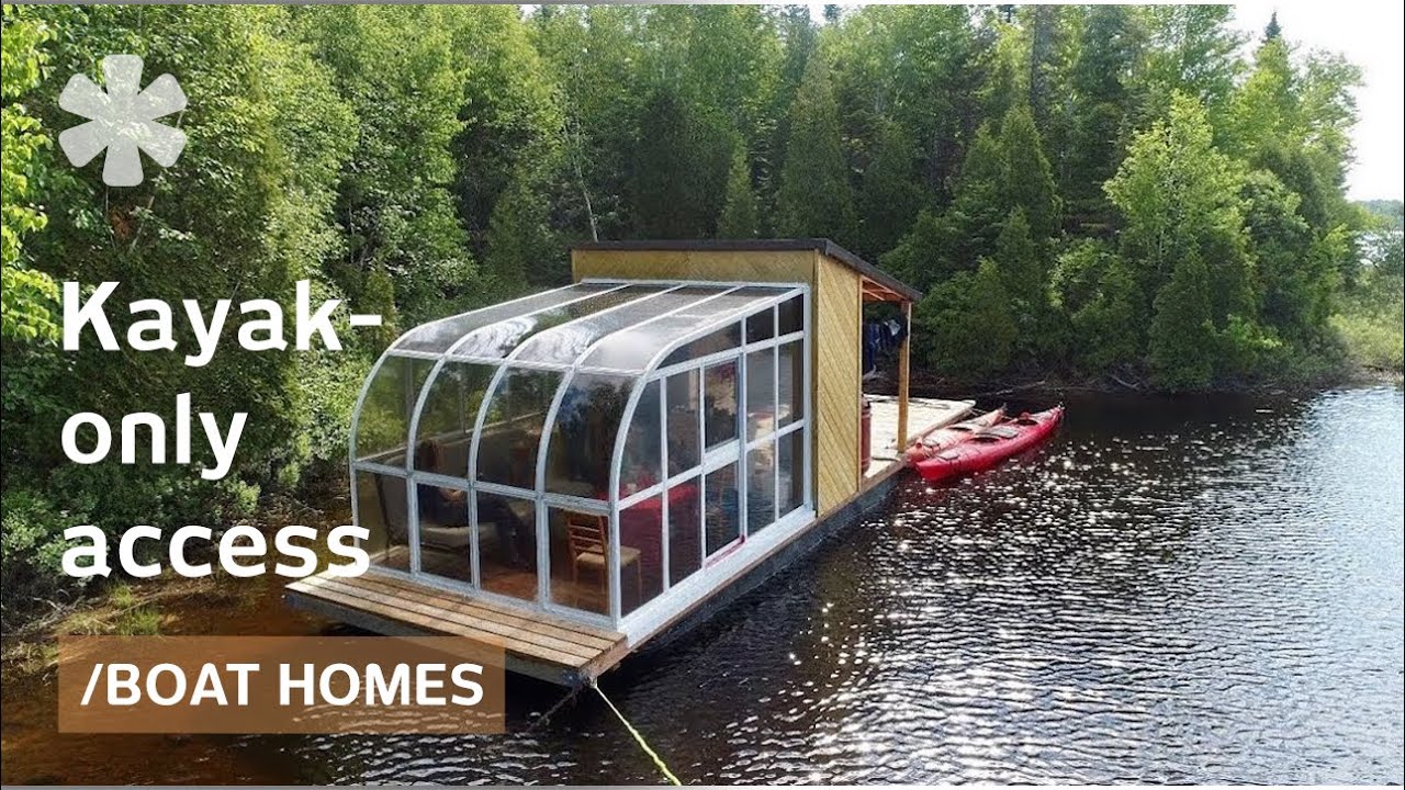 Tiny boat home packs sunroom & dock on remote kayakers' lake