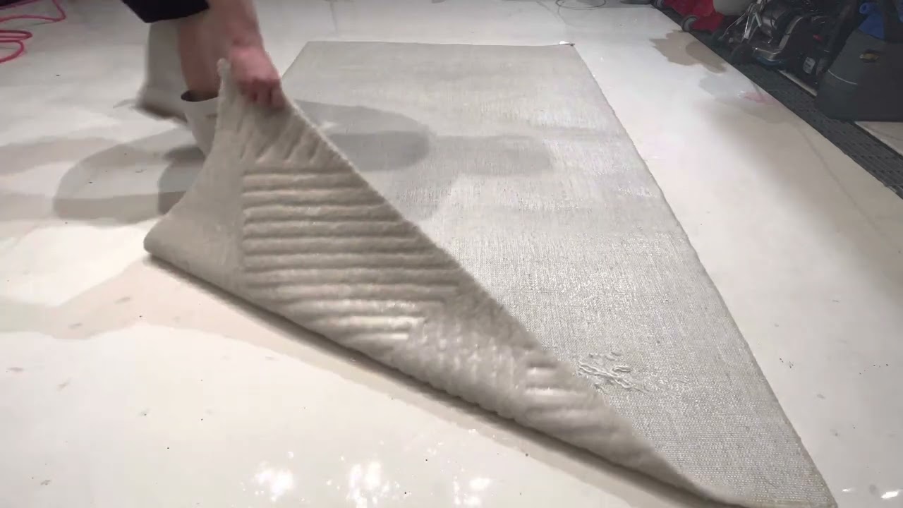 Yellow stain disappears on a bright white viscose rug