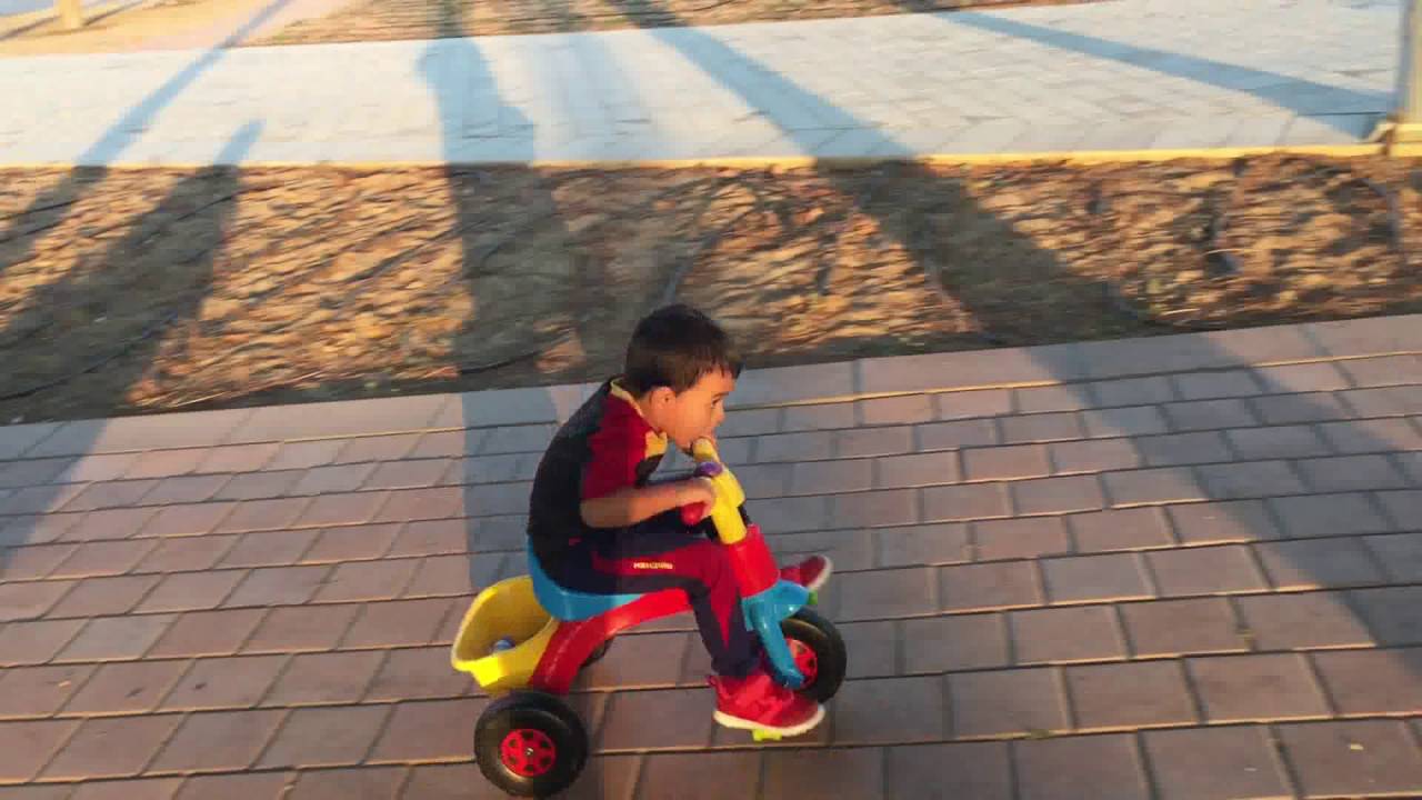 Baby Riding Tricycle.