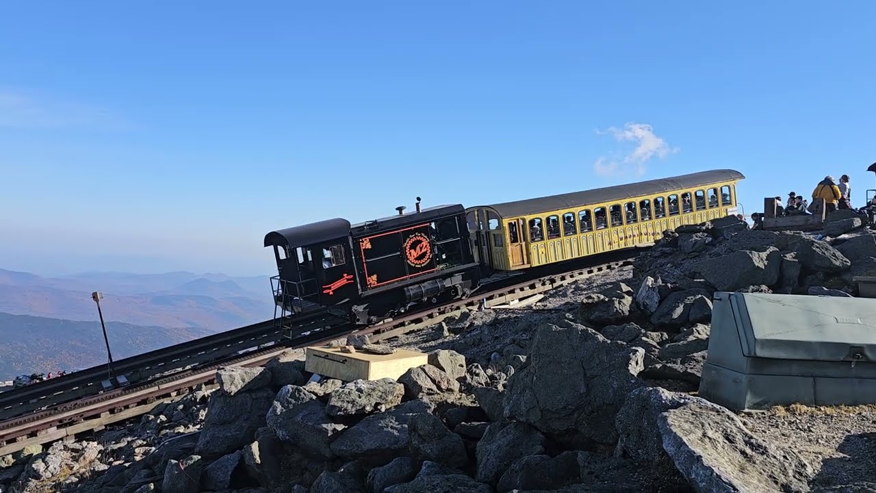 Cog Trains With Orange Fall Foliage Background
