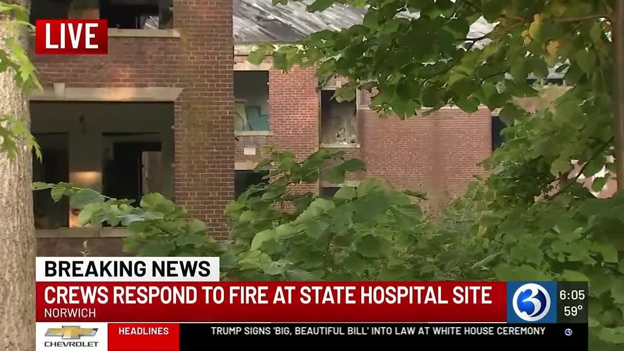 Firefighters work to put out fire at former Norwich State Hospital