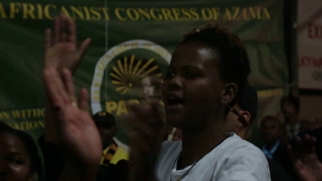 Azania Kenya France leading a revolutionary song at Ras Moziah's Memorial service filmed by Kasibe