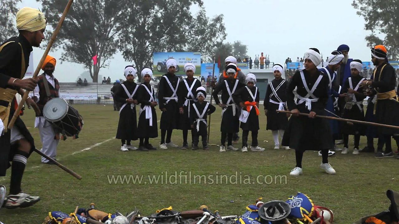 Nihang Sikh displaying gatka skills at Kila Raipur