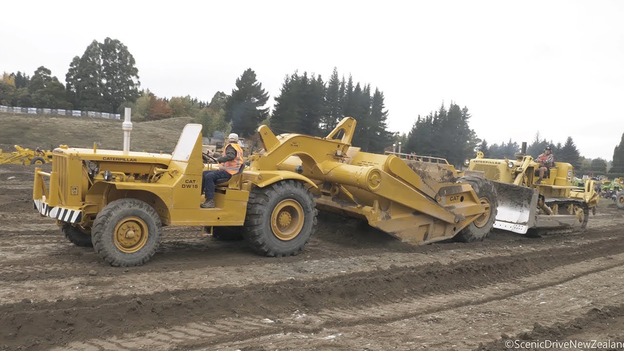 Caterpillar DW15 Tractor Scraper getting pushed by a CAT D8H Bulldozer