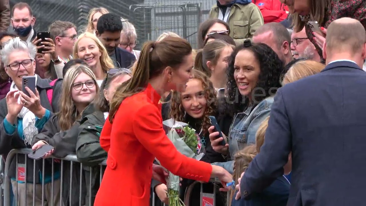 Duke and Duchess of Cambridge, Prince William and Kate, do walkabout in Cardiff with their children