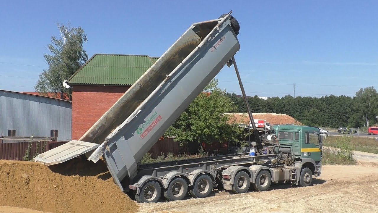 MAN TGA with Grünwald tipper semitrailer unloading