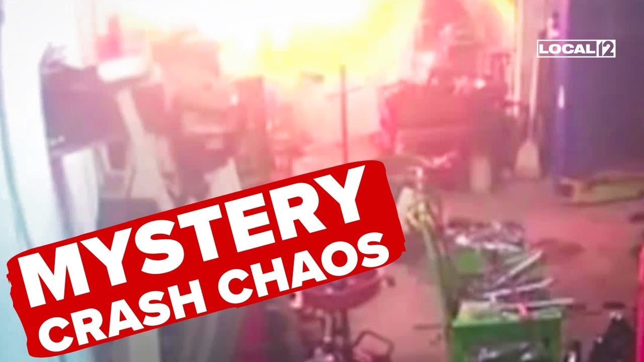 VIDEO: Unidentified object crashes into auto shop, causing bright flash and damage